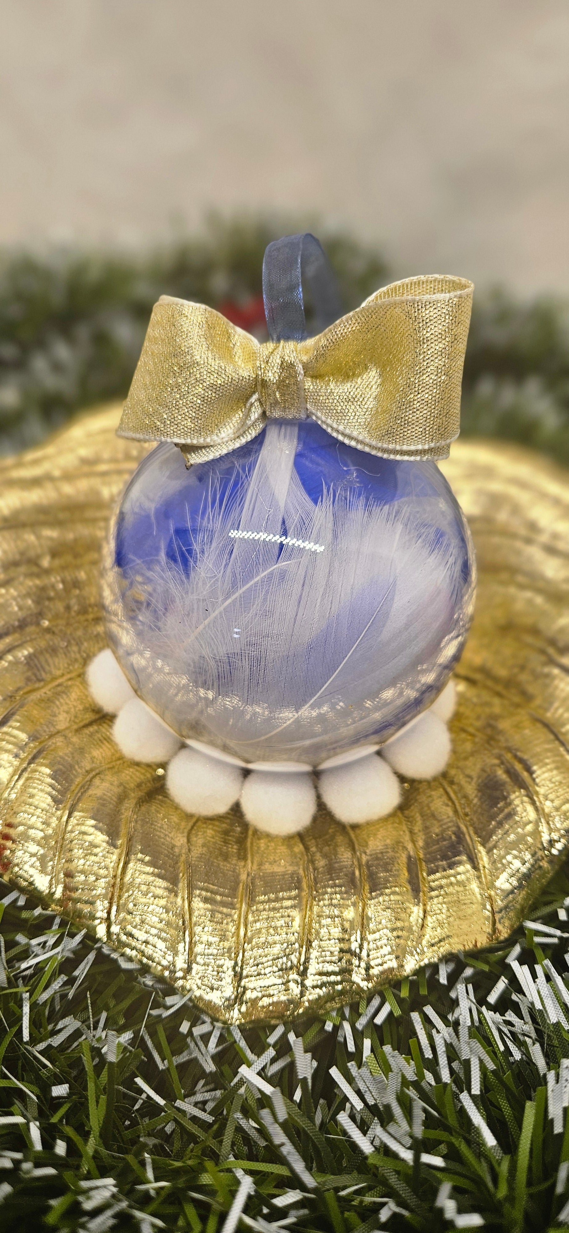 Boule plume bleu